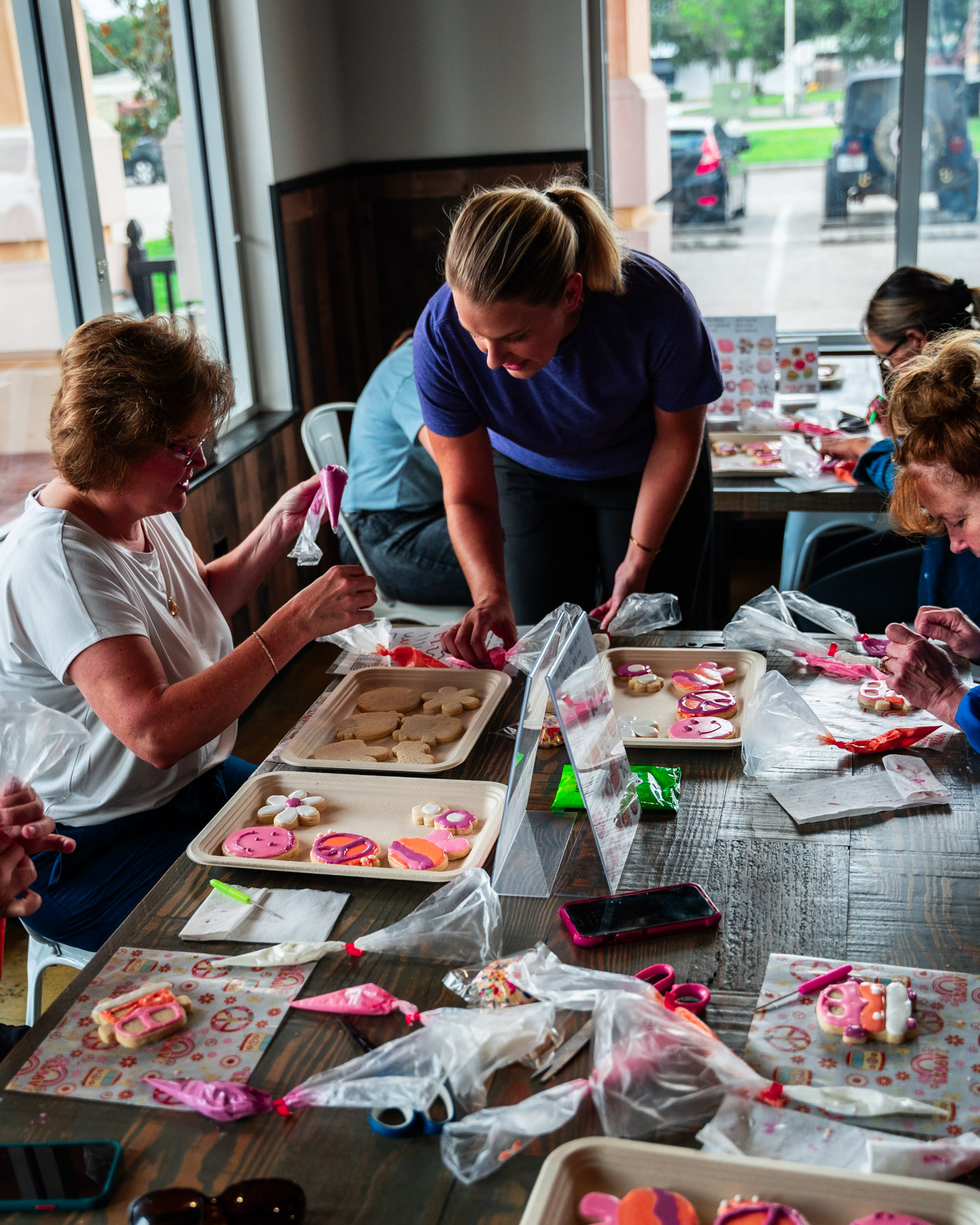 Ellie teaching guests during a cookie decorating class in Tampa