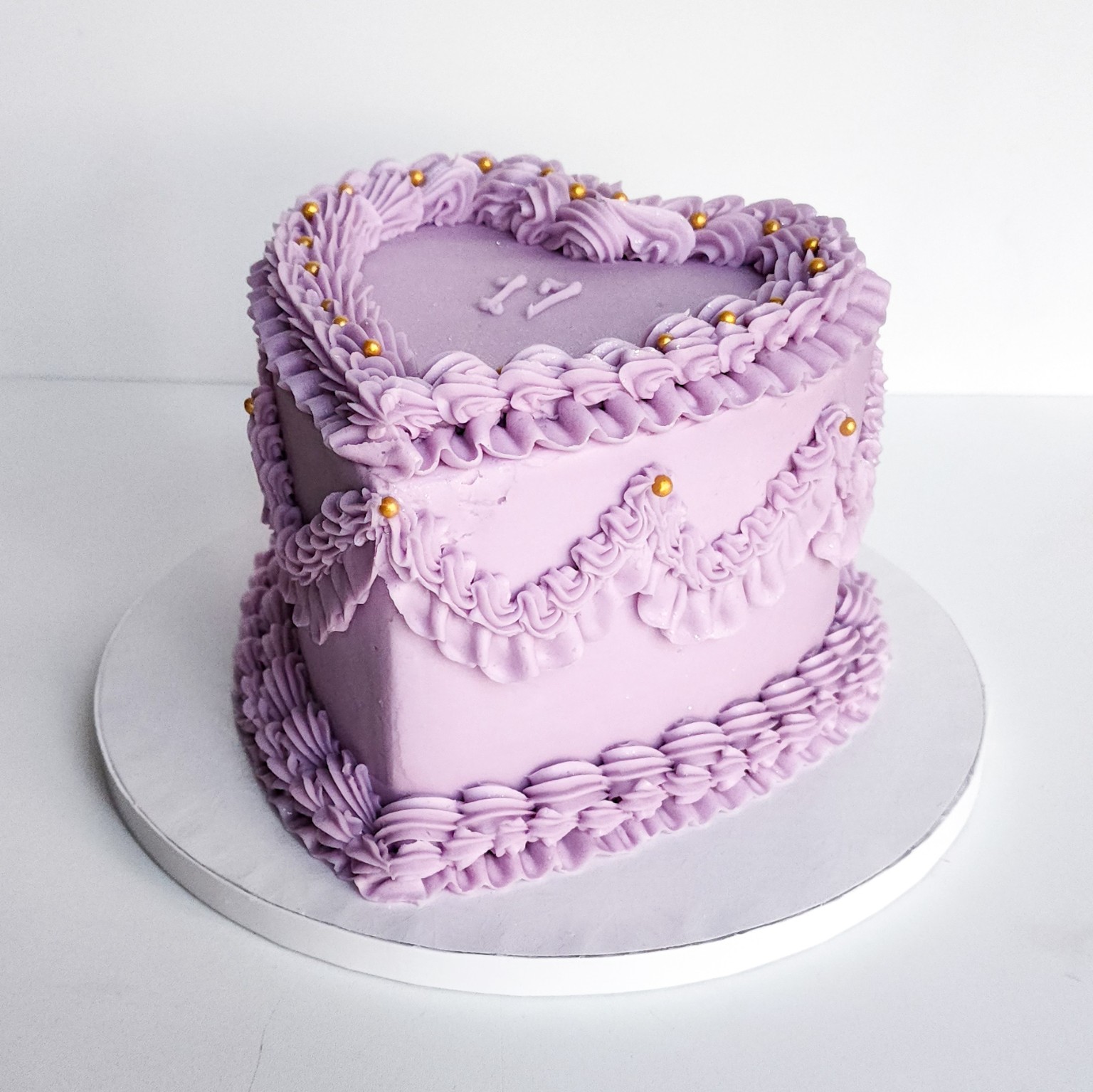 Lavender heart-shaped buttercream cake by Ellie Mae's Bakery