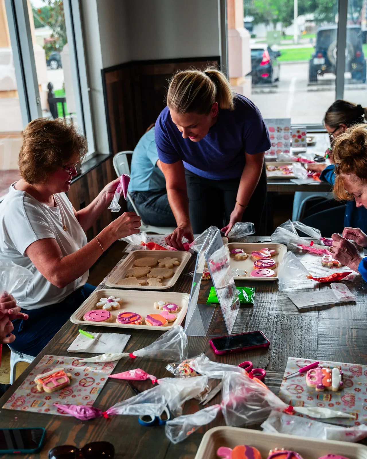 Ellie teaching guests during a cookie decorating class in Tampa