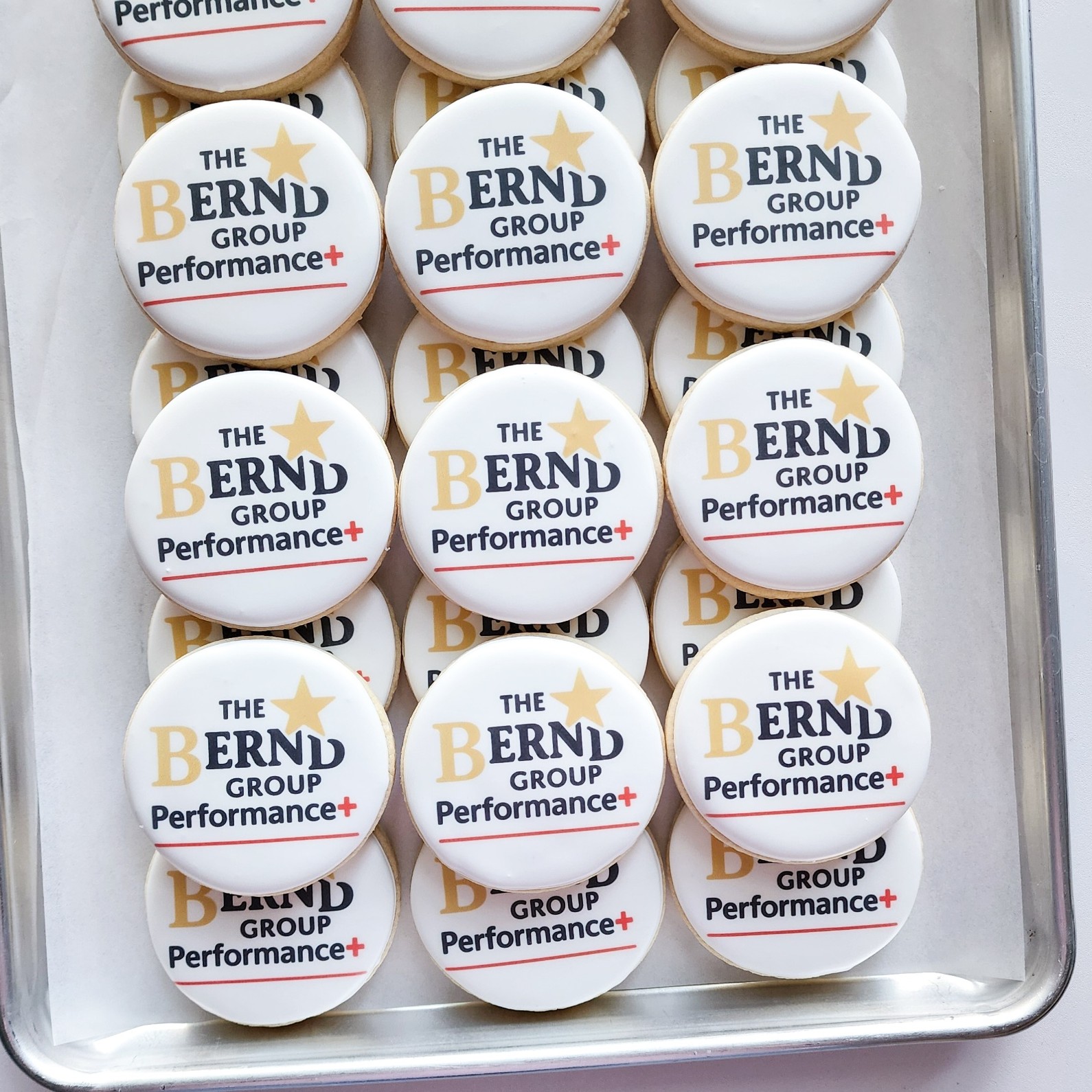 Sugar cookies printed with company logos and branded artwork