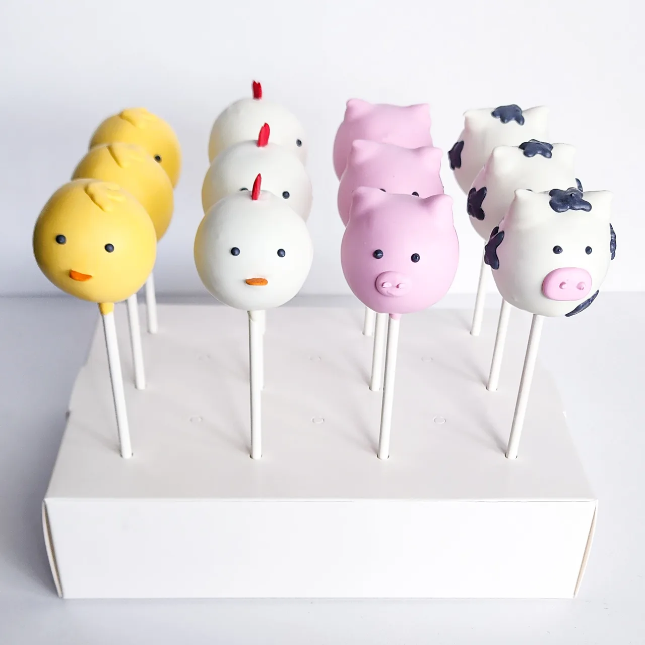 Farm animal cake pops — chicks, chickens, pigs, and cows