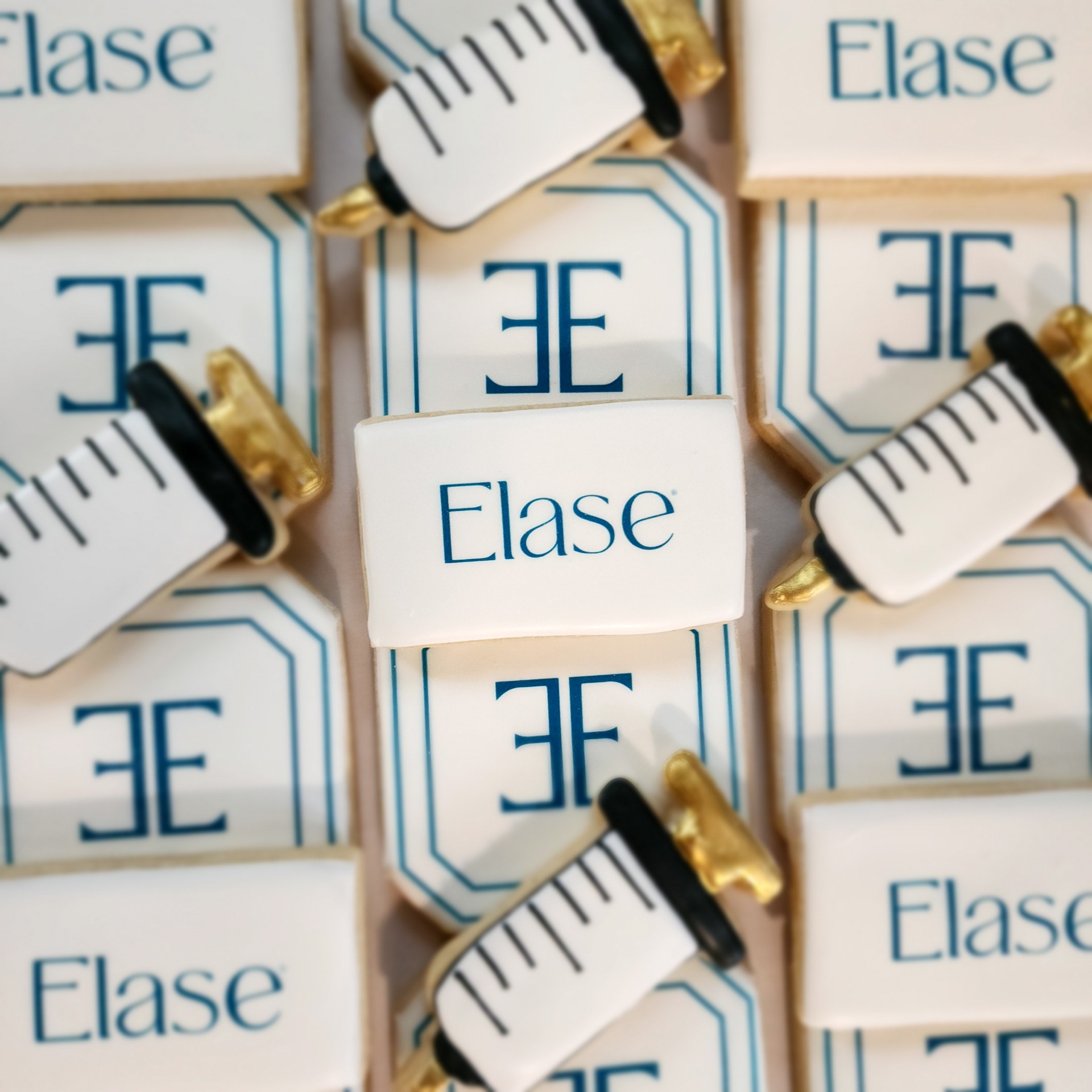 Elase branded logo cookies with syringe accents
