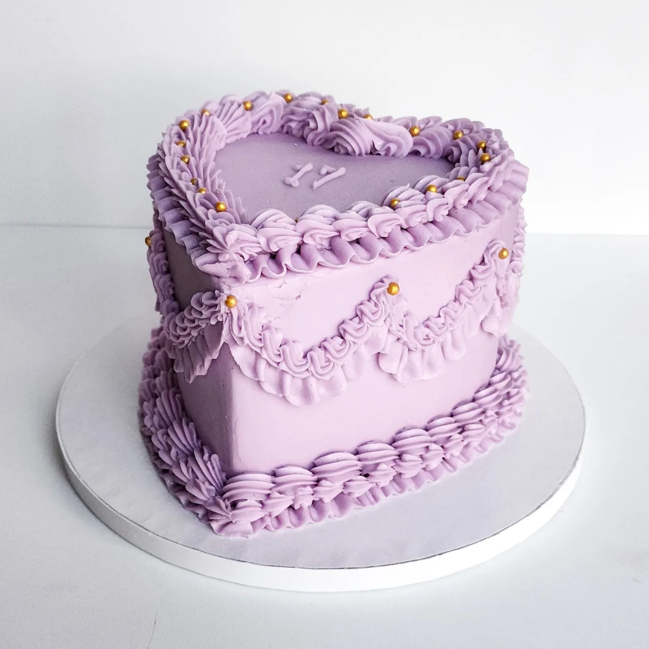 Lavender heart-shaped buttercream cake by Ellie Mae's Bakery