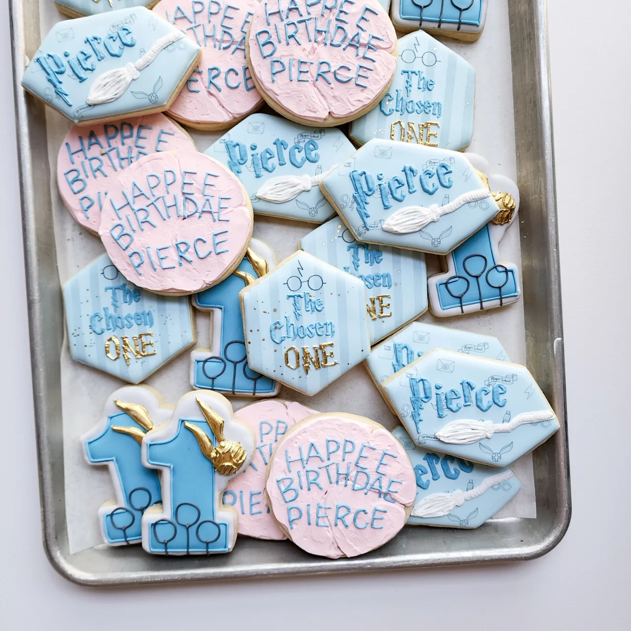 Pink and blue wizard-themed birthday cookies